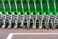 Valencia, Spain - July 3, 2019: Detail of the plastic wheels of shopping carts in a supermarket lined up Royalty Free Stock Photo
