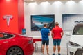 Two buyers of a Tesla Model S electric car on display at Valencian Tesla store Royalty Free Stock Photo