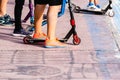 Valencia, Spain - June 8, 2019: Children, unrecognizable, with their sneakers, mounted on their skates in a skatepark