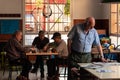 Four elderly retired people inside a bar in the city of Valencia