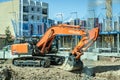 Valencia, Spain - March 30, 2019: Hitachi backhoe working on the construction of the foundations of a building