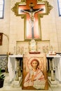 Valencia, Spain - March 30, 2019: Interior of a chapel of a Catholic church with a portrait of Jesus and crucifix on the altar