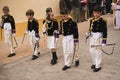 Valencia, Spain - March 24, 2024: People in religious costumes take part in the Palm Sunday procession In Valencia, Spain