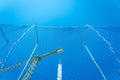 Valencia, Spain - March 30, 2019: Protection net in a masonry worksite in the construction of the pillars of an building, with a Royalty Free Stock Photo