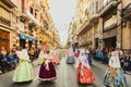 Valencia, Spain - March 17, 2019: Several of the thousands of women Falleras who parade down the street of La Paz with their