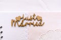 Valencia, Spain - October 20, 2018: Wooden sign with the word Just Married on a photo book Royalty Free Stock Photo