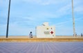 Valencia Spain; 05/25/2020. People sitting on the beach next to the Red Cross lifeguard station Royalty Free Stock Photo