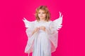 Valentine angel. Little cupid child. Kid angel with angels wings, isolated on pink studio background. Valentines day