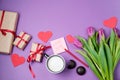 Valentine background with gift box, sweet, hearts and tulips on Royalty Free Stock Photo