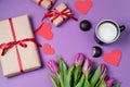 Valentine background with gift box, sweet, hearts and tulips on Royalty Free Stock Photo