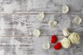 Valentine background, white rose flowers and petals scattered on Royalty Free Stock Photo