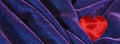 Valentine banner with red silk hearts on Dark purple velvet