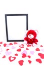 Valentine bear with a black picture frame and heart foreground