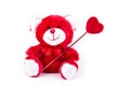 Valentine bear holding a heart on a stick