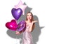 Valentine Beauty girl with pink heart shaped air balloons portrait pointing hand,  on white background Royalty Free Stock Photo