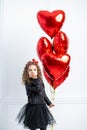 Valentine Beauty young girl, teenager with red air balloon portrait, isolated on white background. Beautiful Happy Young Royalty Free Stock Photo