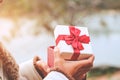 Woman hands holding a red gift box Royalty Free Stock Photo