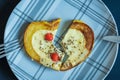 Valentine broken heart shape pumpkin slices omelette on plate Royalty Free Stock Photo