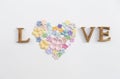 Valentine card background concept, love wooden font with paper flower arrange in heart shape Royalty Free Stock Photo