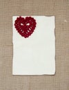 Valentine card with crochet heart Royalty Free Stock Photo