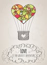 Valentine card with a heart-shaped hot air balloon and a love slogan