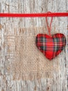 Valentine card with textile heart and sacking on old wood Royalty Free Stock Photo