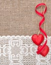 Valentine card with wooden hearts and lacy cloth Royalty Free Stock Photo
