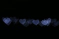 Valentine Colorful heart-shaped white on black background lighting bokeh for decoration at night backdrop wallpaper blurred valent