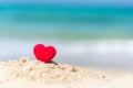 Valentine Concept. Red hearts on the sand summer