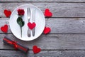 Valentine day background, cutlery with rose on plate on wood Royalty Free Stock Photo