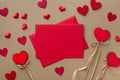 Valentine day background. Envelope, greeting card and red hearts for holiday message. Flat lay