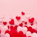 Valentine day background of fly paper red and pink hearts on pink color backdrop. Copy space. Royalty Free Stock Photo