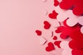 Valentine day background of fly paper red and pink hearts on pink color backdrop. Copy space. Royalty Free Stock Photo