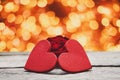 Valentine day background, handmade hearts on wood with holiday lights