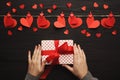 Valentine day background, paper hearts border and gift on wood Royalty Free Stock Photo