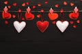 Valentine day background, pillow hearts border on wood, copy space Royalty Free Stock Photo