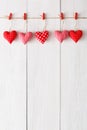 Valentine day background, pillow hearts border on wood, copy space Royalty Free Stock Photo