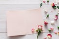 Valentine day background, rose flowers and card on white wood Royalty Free Stock Photo