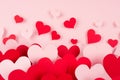 Valentine day background. Stream of fly out red and pink paper hearts on pink color backdrop. Royalty Free Stock Photo