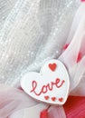 Valentine Day Banner Design. Delicious heart shaped cookie on a beautiful fabric background Royalty Free Stock Photo