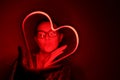 Valentine day. Beautiful girl with neon signs. Neon sign red heart Royalty Free Stock Photo