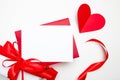Valentine Day card mockup white red envelope and heart with gift box on white background, top view, flat lay. Blank invitation, Royalty Free Stock Photo