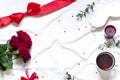 Valentine day concept frame on the white blanket with a bow. Holiday top view card with red roses. Royalty Free Stock Photo