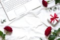 Valentine day concept frame on the white blanket with a laptop. Royalty Free Stock Photo