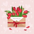 Tulips in a craft envelope with a love note and hearts Royalty Free Stock Photo