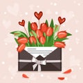 Tulips in a craft envelope with a love note and hearts Royalty Free Stock Photo