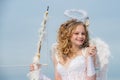 Valentine Day Gift Card - Holiday teen Cupid with Love. Innocent girl. Concept of Valentines Daygirl dressed as an angel