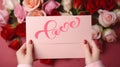 Valentine day greetings card in woman hand ,roses on pink background Royalty Free Stock Photo