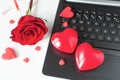 Valentine Day online Shopping. Online communication, virtual love. Laptop, red hearts, red rose. Romantic shopping wedding, women