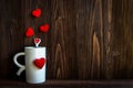 Valentine Day with red cup coffee Sewed pillow hearts row border, old wood background, Royalty Free Stock Photo